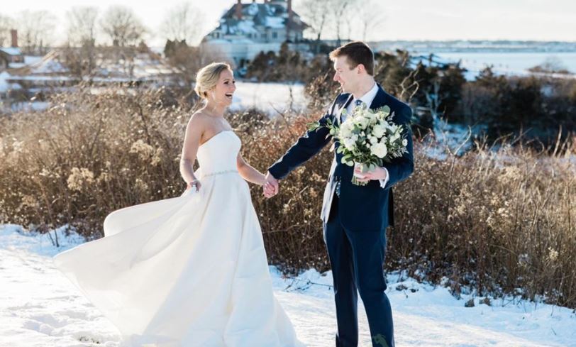 Bride and Groom on Snowy OceanCliff Lawn